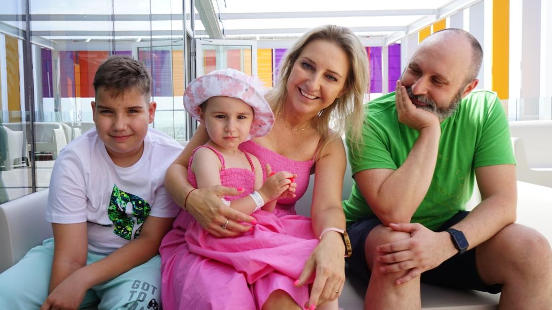 Barbara poses with her family on the terrace of the SJD Pediatric Cancer Center Barcelona