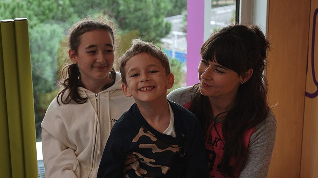 Ivan on a visit to the SJD Barcelona Children's Hospital, with his mother and sister.