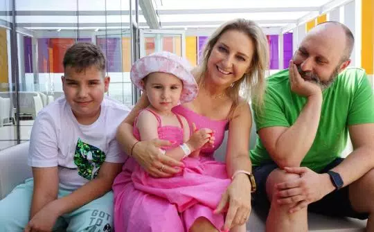 Barbara poses with her family on the terrace of the SJD Pediatric Cancer Center Barcelona