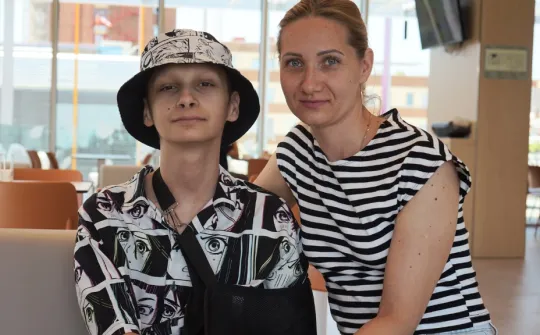 Yaroslav with his mother in the restaurant of the SJD Pediatric Cancer Center Barcelona