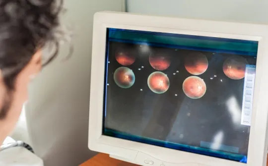 Ophthalmologist assessing a retinal scan - SJD Barcelona Children's Hospital