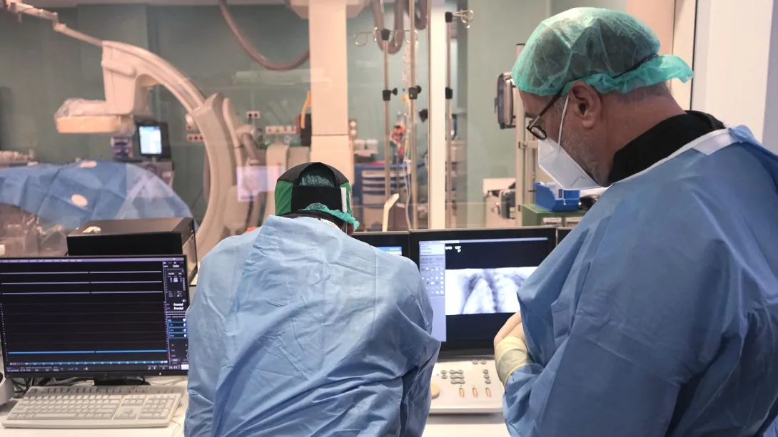 The two surgeons review an imaging test in the operation theatre. The two surgeons review an imaging test in the operation theatre.