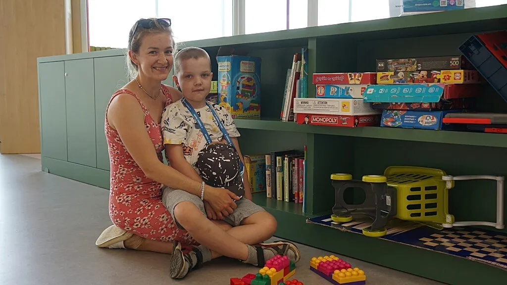 Viachaslau with his mother in the playroom of the SJD Barcelona Children's Hospital Viachaslau with his mother in the playroom of the SJD Barcelona Children's Hospital