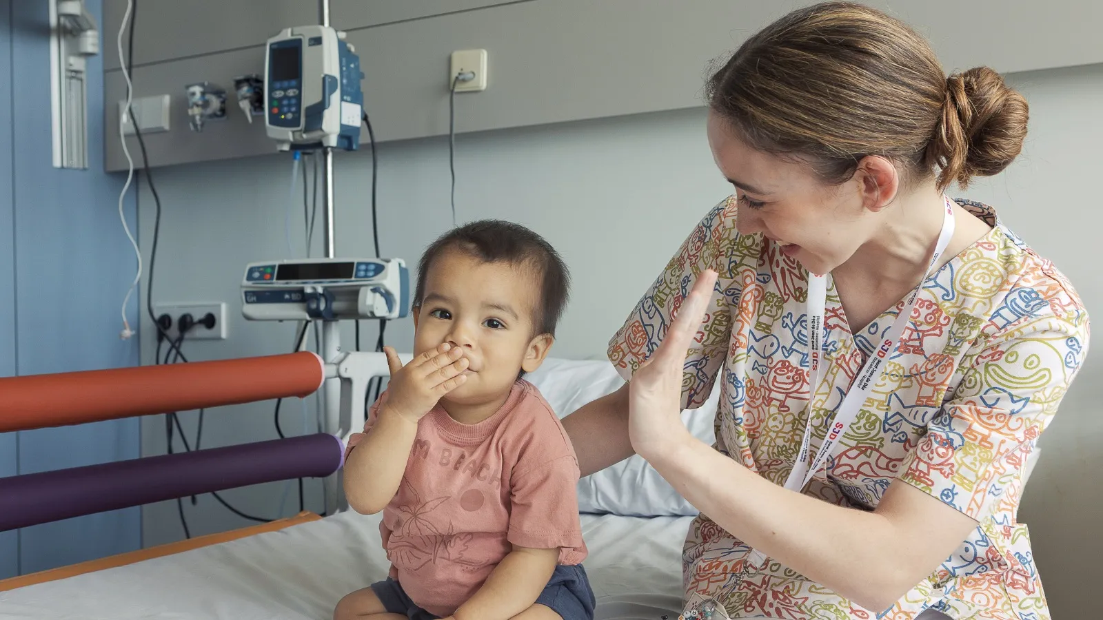A patient with a nurse at the SJD Barcelona Children's Hospital A patient with a nurse at the SJD Barcelona Children's Hospital